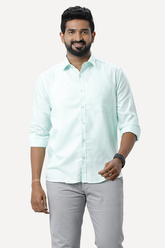 light blue shirt and gray pants