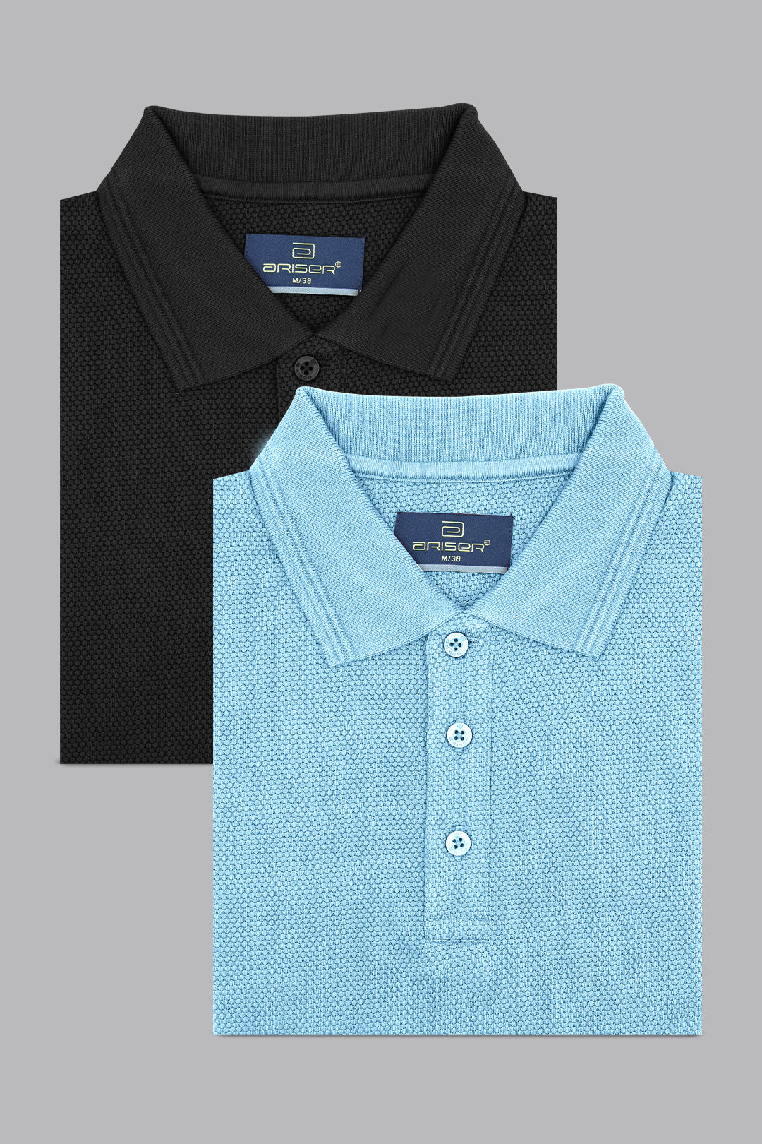 Two-folded polo shirts, black and blue, on a gray background.
