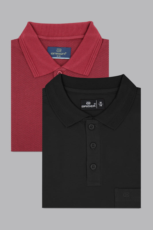 Two folded polo shirts, one red and one black, on a gray background.