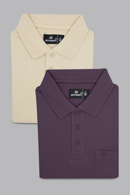 Two folded polo shirts, one beige and one purple, on a gray background.
