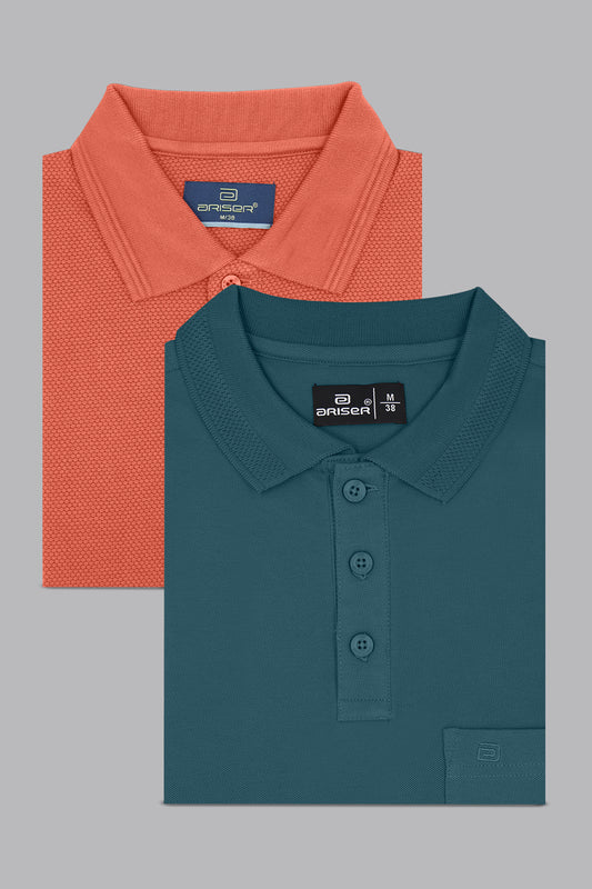 Two folded polo shirts, one orange and one teal, on a gray background.
