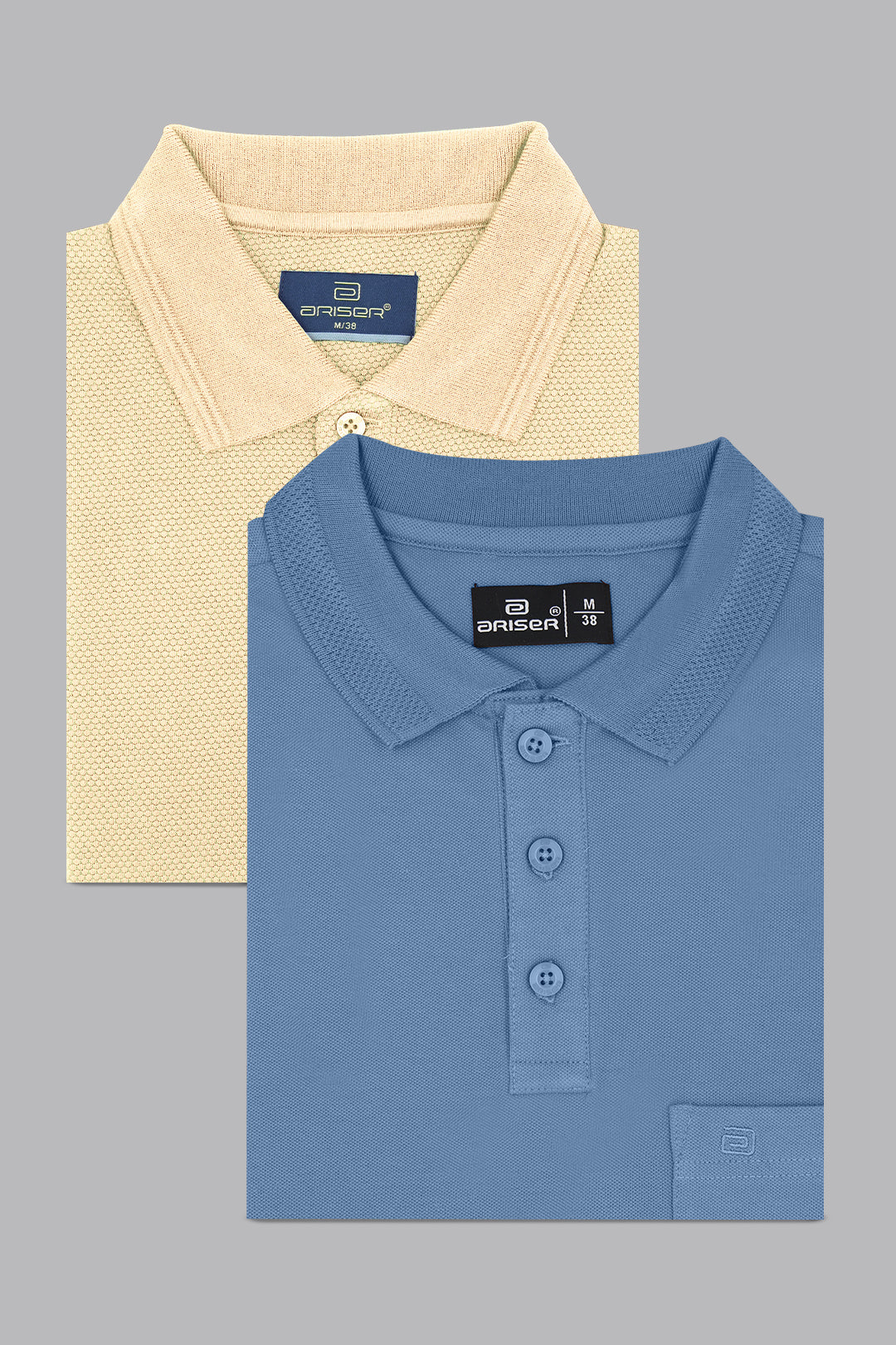 Two folded polo shirts, one beige and one blue, on a gray background.