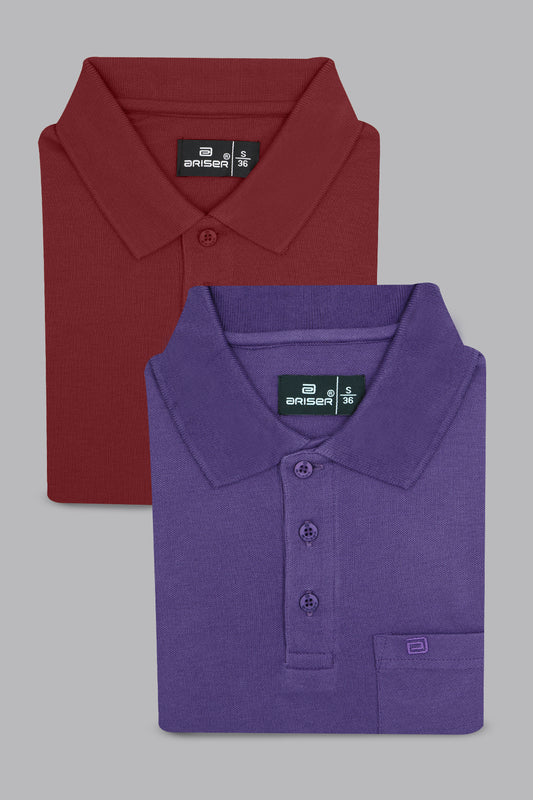 Two folded polo shirts, one red and one purple, on a gray background.
