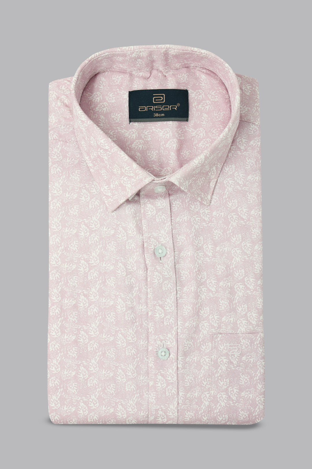 Pink patterned shirt with a brand label on a gray background