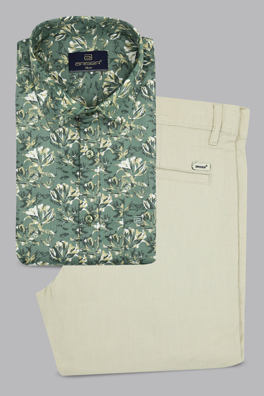 Green floral shirt and beige pants on a gray background
