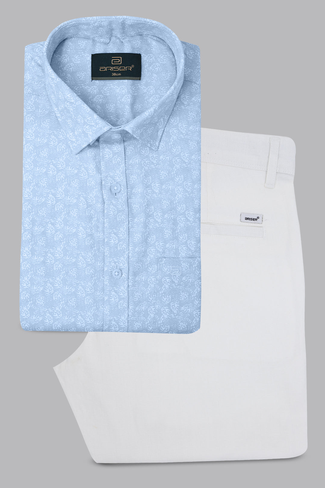Light blue patterned shirt and white pants on a gray background
