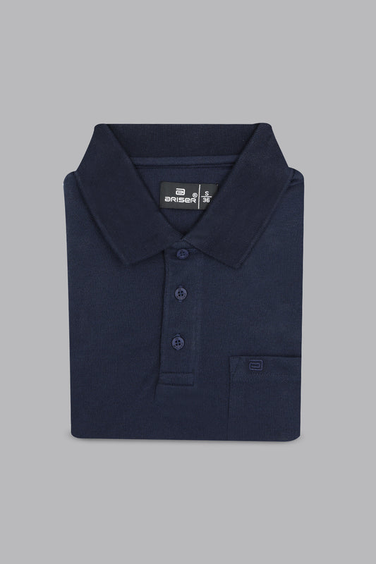 Folded navy blue polo shirt on a gray background