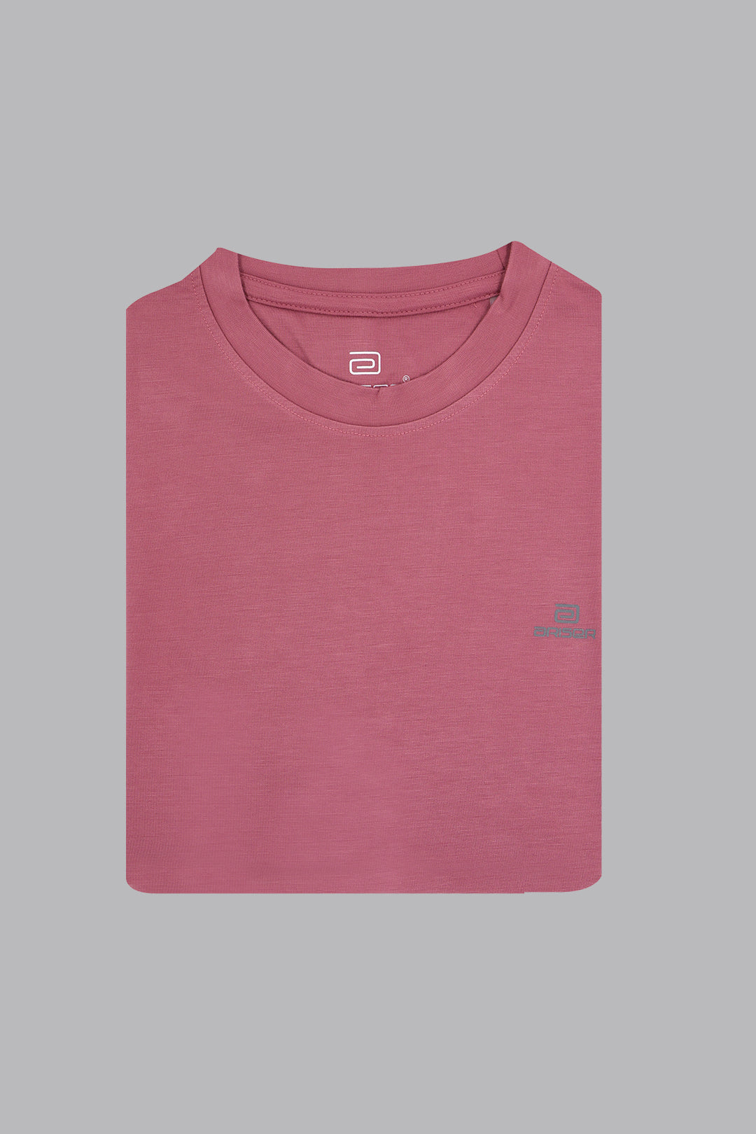 Folded pink t-shirt with a logo on a gray background