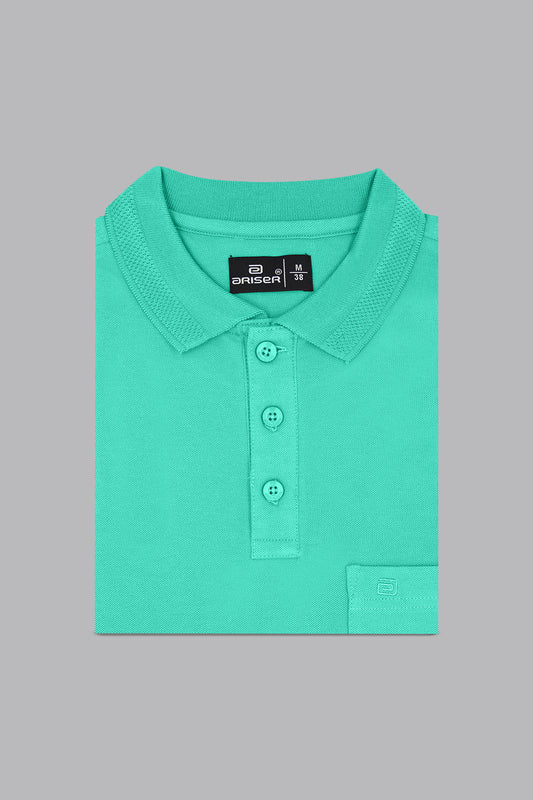 Green polo shirt with a brand label on a gray background