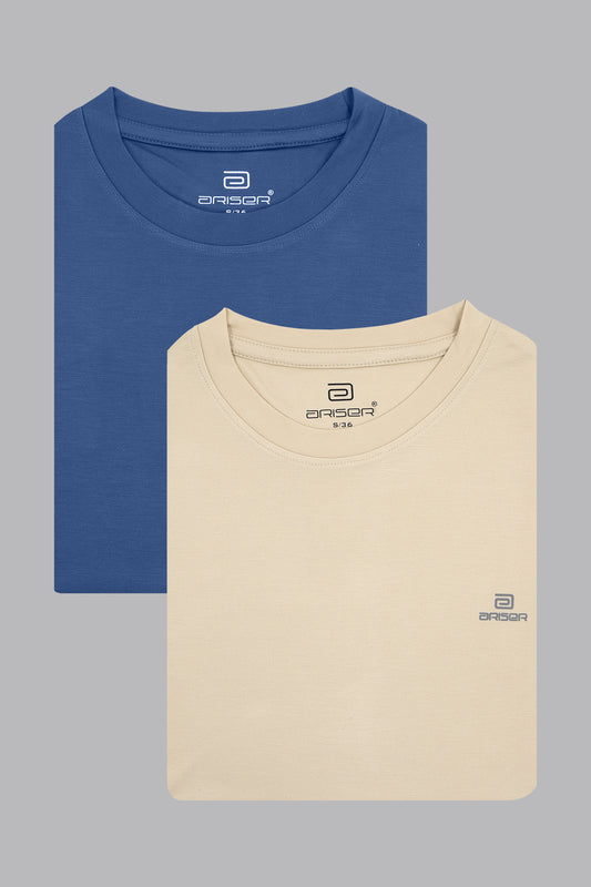 Two folded t-shirts, one blue and one beige, on a gray background.