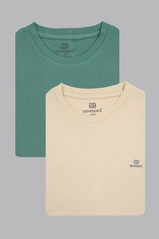 Two folded t-shirts, one green and one beige, on a gray background with a ariser brand logo.