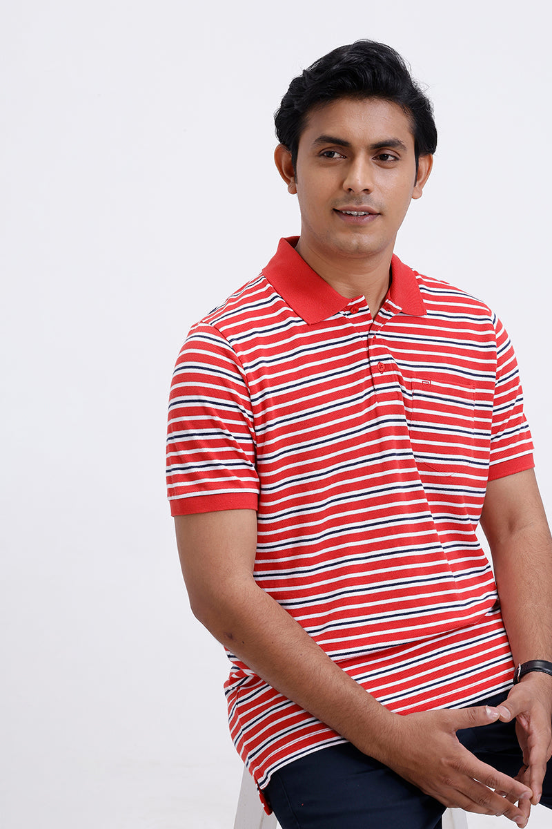 Man wearing a red and white striped polo shirt on a white background