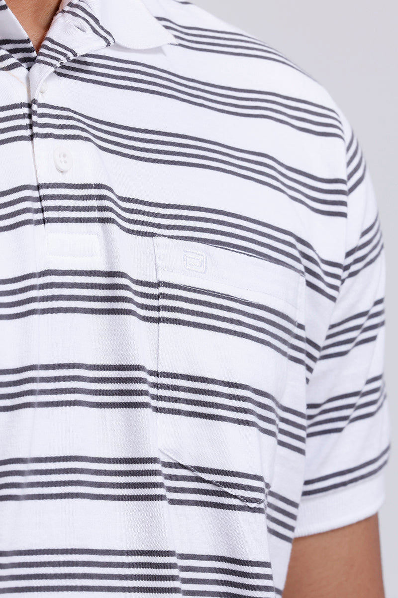 Close-up of a white t-shirt with black horizontal stripes on a plain background