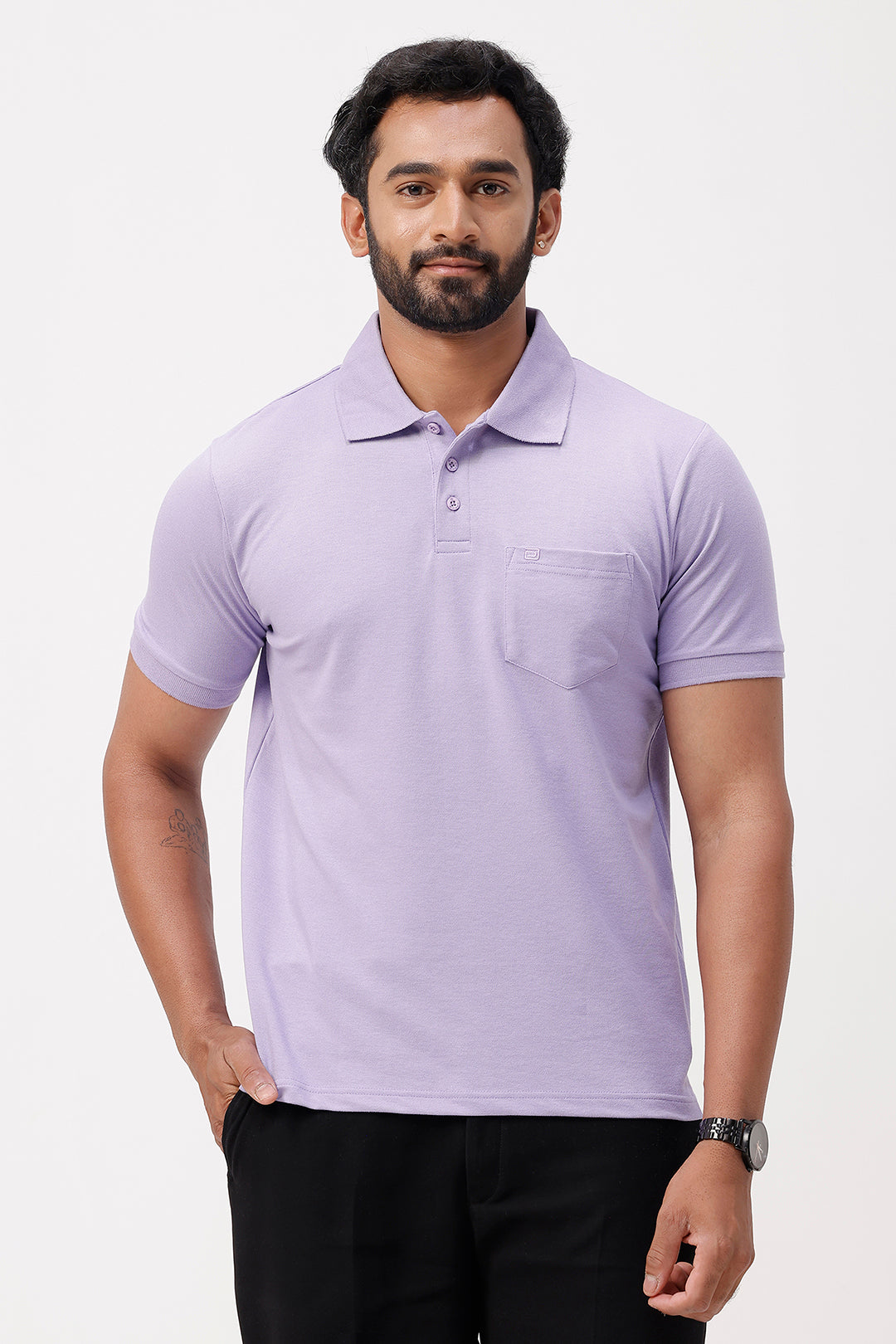 Man wearing a soft lavender polo shirt on a white background